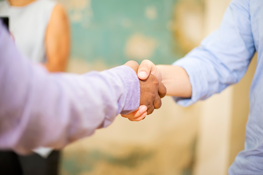 two people shaking hands